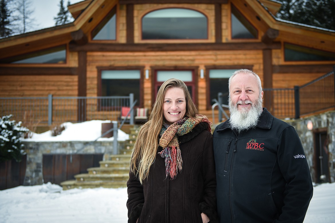 Willow Holm (left) and Danny Ray Marsh (right) stand in front of one of the main structures at Relics Retreat. They are the only employees of the retreat. (Casey Kreider/Daily Inter Lake)