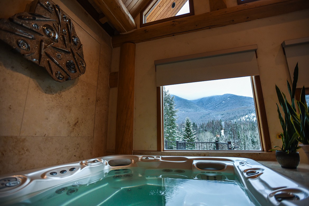 An ancient ammonite fossil sits perched above a jet tub at Relics Retreat. The spa features a handful of imported fossils believed to be at least 50 million years old. (Casey Kreider/Daily Inter Lake)