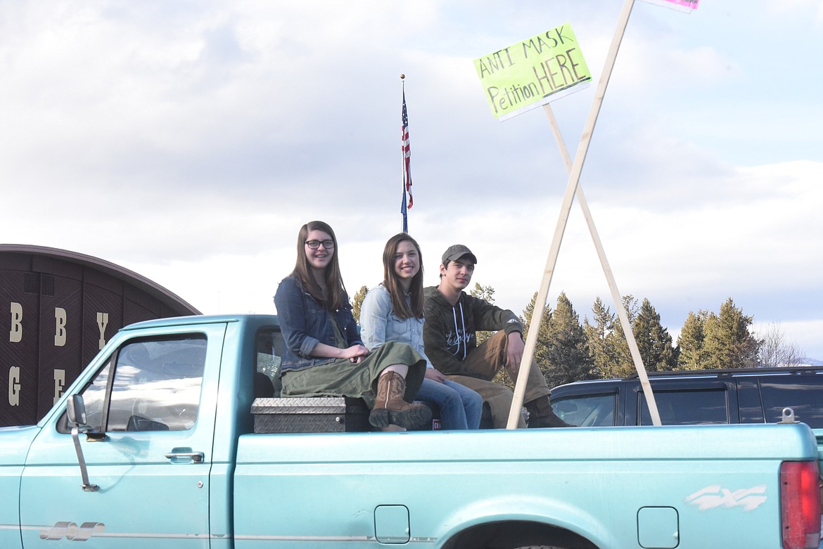 High school students from left Alaina Moore, Samantha Newton and Jake Newton gathered signatures for their anti-mask petition in the parking lot of Libby Middle High School. (Will Langhorne/The Western News)