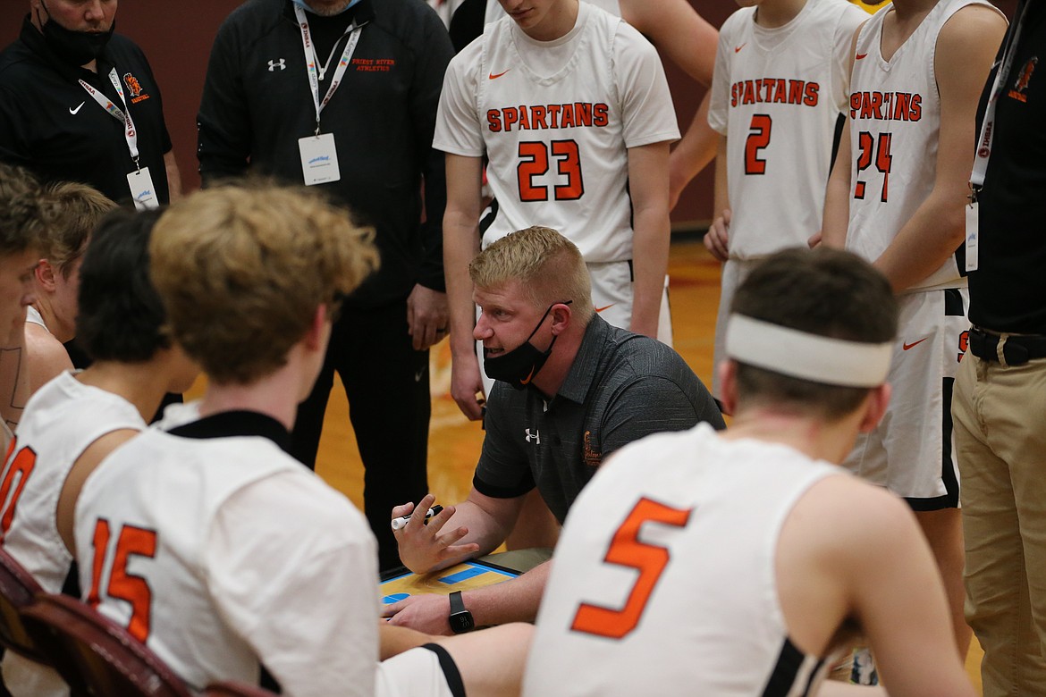 Priest River head coach Kevin Wylie talks to his team during a timeout on Thursday.