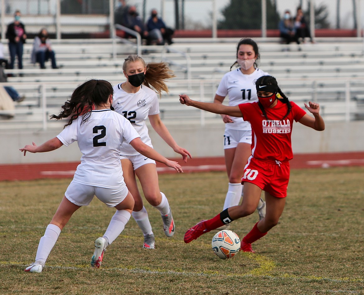 Othello's Janelly Verduzco is swarmed by defenders as she dribbles towards the North Central goal in the second half of the Huskies 2-1 defeat at home on Thursday afternoon at Othello High School.
