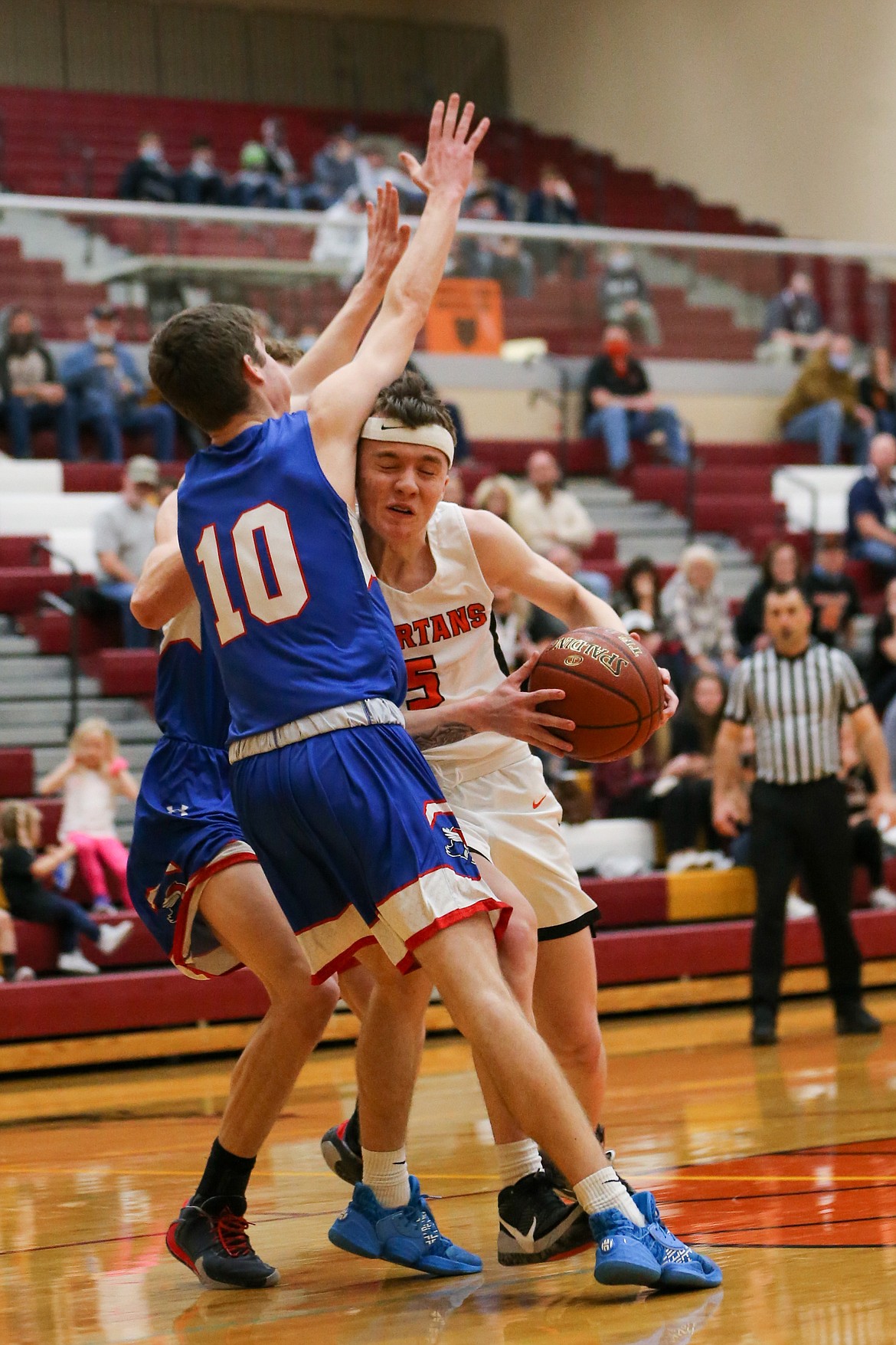 Junior Trentyn Kreager fights through contact in the paint on Thursday.