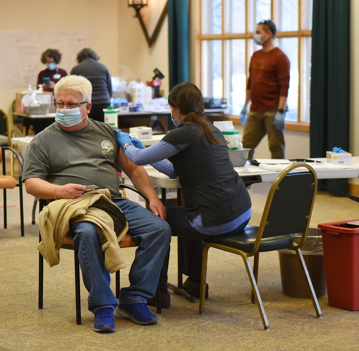 Greg Crawford receives the COVID-19 vaccine on Thursday at Grouse Mountain Lodge. North Valley Hospital is holding vaccine clinics weekly in collaboration with the Flathead City-County Health Department. (Heidi Desch/Whitefish Pilot)