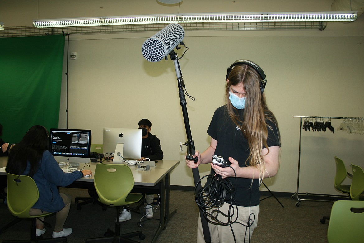 Austin Peterson does a sound check on a boom mike. Peterson is a student in the digital arts and filmmaking class at Columbia Basin Technical Skills Center.