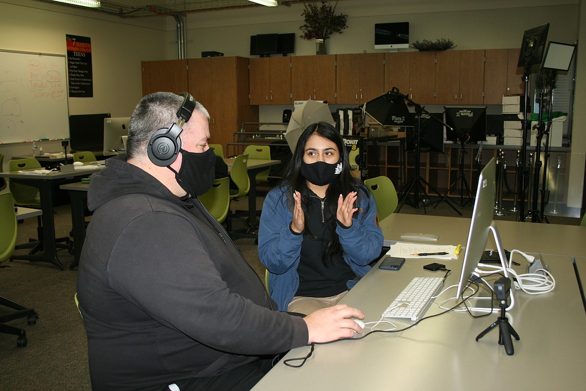 Joe LaRosee (front), digital arts and filmmaking instructor at Columbia Basin Technical Skills Center, discusses a movie scene with student Aaliyah Cervantes (back).
