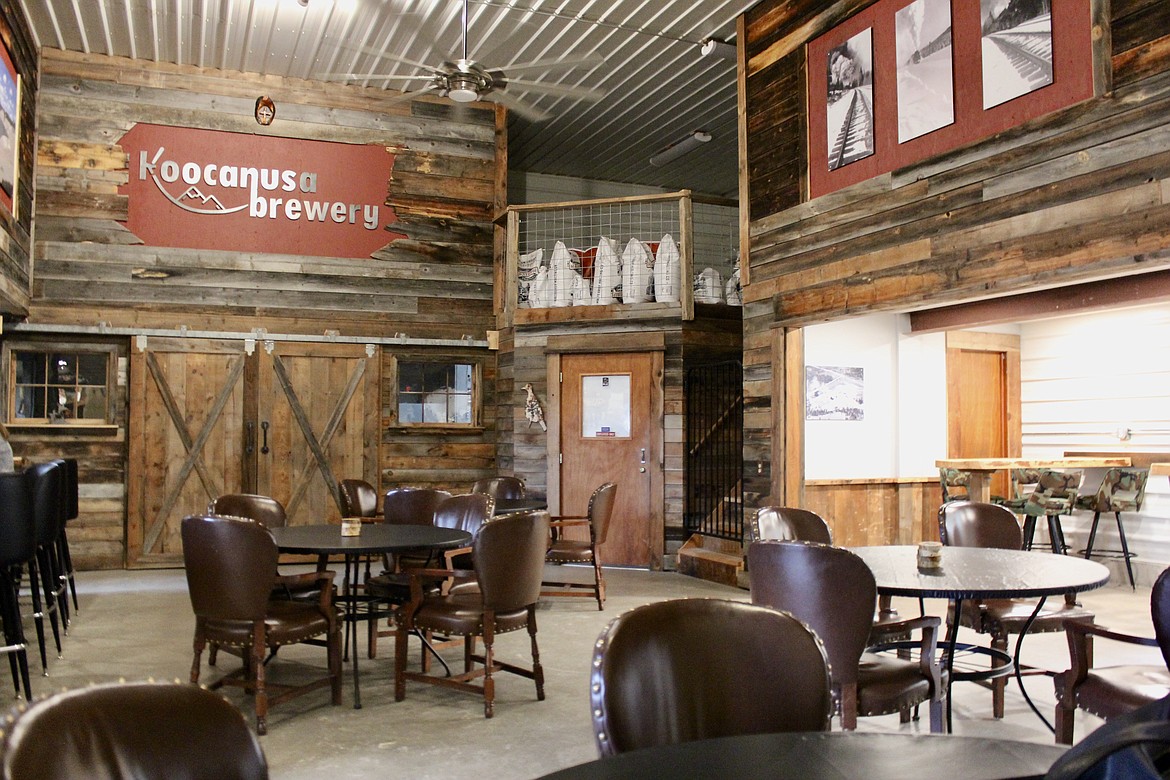 The inside of Koocanusa Brewing Company is decorated with dark wood materials and images from when Eureka was primarily a logging community. Owner Barry Roose says the photos are a nod to the area's rich history. (Kianna Gardner/Daily Inter Lake)