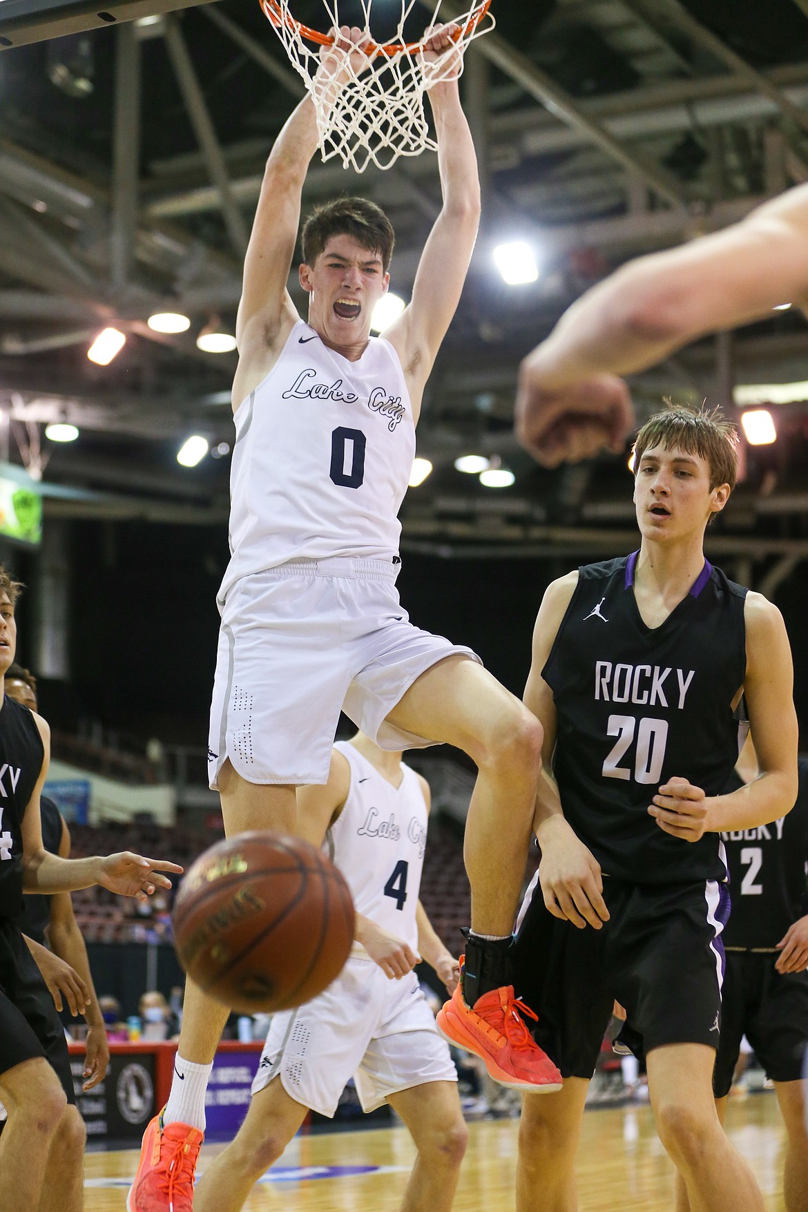 JASON DUCHOW PHOTOGRAPHY
Blake Buchanan (0) of Lake City slams down a putback in the waning second of the first half Thursday against Rocky Mountain in a state 5A first-round game at the Ford Idaho Center in Nampa.