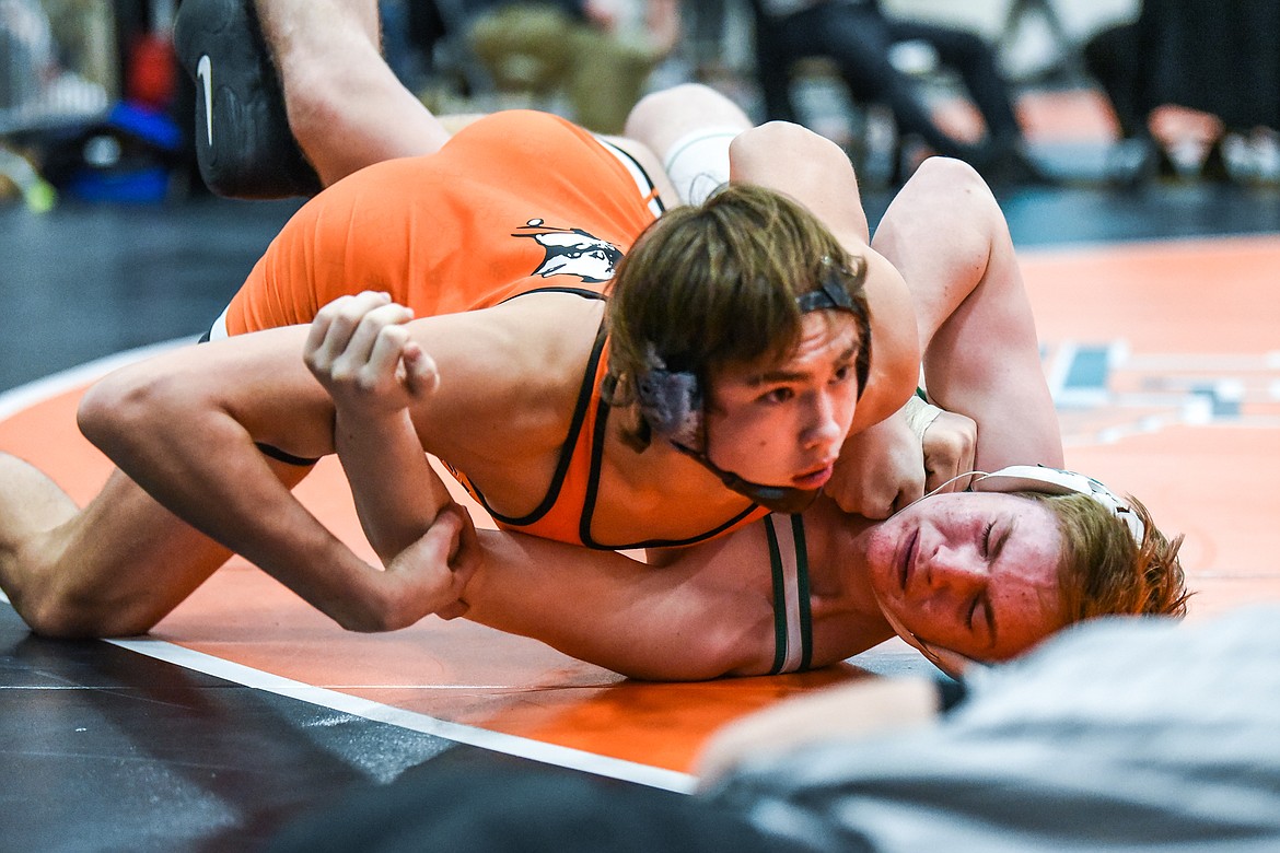 Flathead's Chase Youso pins Belgrade's Hunter Rowan at 170 lbs. at the State AA wrestling championships at Flathead High School on Friday. (Casey Kreider/Daily Inter Lake)