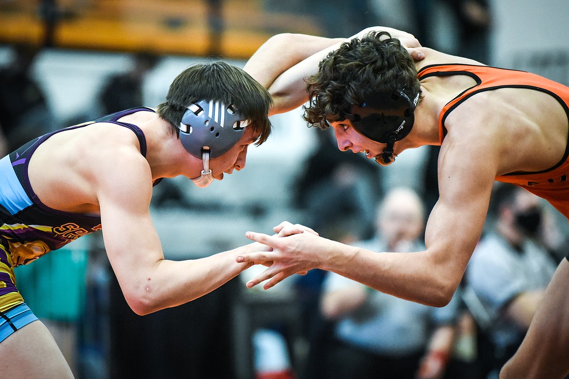 Flathead's Asher Kemppainen wrestles Missoula Sentinel's Novik Thomas at 132 lbs. during the State AA wrestling championships at Flathead High School on Friday. (Casey Kreider/Daily Inter Lake)