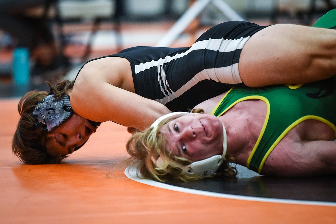 Flathead's Chase Youso wrestles Great Falls CMR's Gabe Price at 170 lbs. at the State AA wrestling championships at Flathead High School on Friday. (Casey Kreider/Daily Inter Lake)