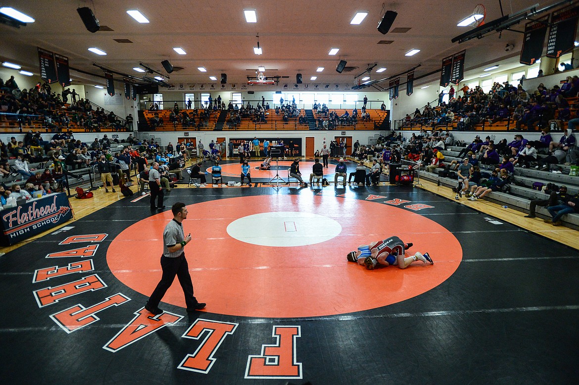 Wrestlers square off at the State AA wrestling championships at Flathead High School on Friday. (Casey Kreider/Daily Inter Lake)