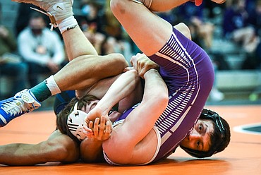 Glacier's Teegan Vasquez pins Butte's Cole Worley at 120 lbs. during the State AA wrestling championships at Flathead High School on Friday. (Casey Kreider/Daily Inter Lake)