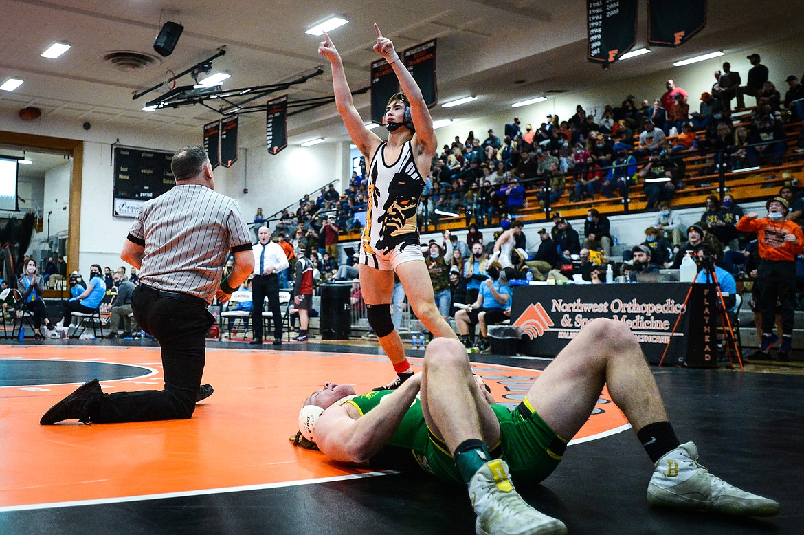 Flathead's Chase Youso celebrates after his third place win over Great Falls CMR's Gabe Price at 170 lbs. at the State AA wrestling tournament at Flathead High School on Saturday. (Casey Kreider/Daily Inter Lake)