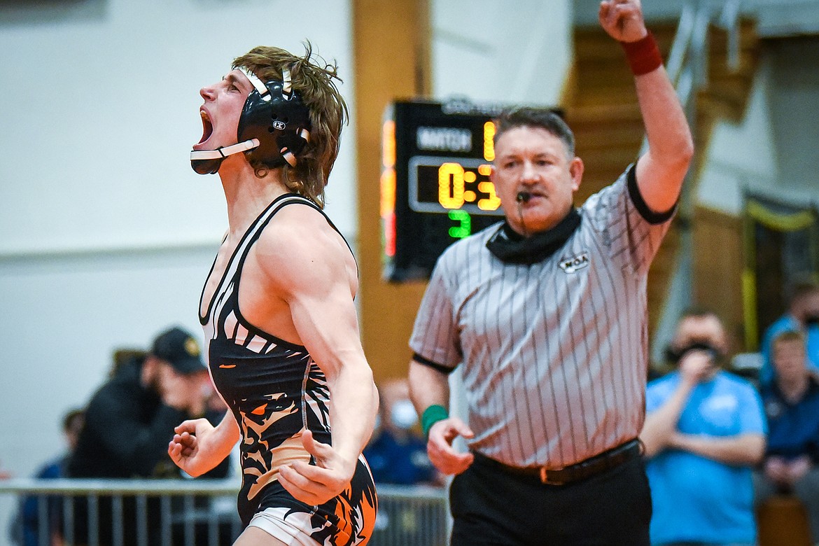 Flathead's Ethan Freund celebrates after defeating Billings West's Jesse Aarness at 126 lbs. for first place at the State AA wrestling tournament at Flathead High School on Saturday. (Casey Kreider/Daily Inter Lake)