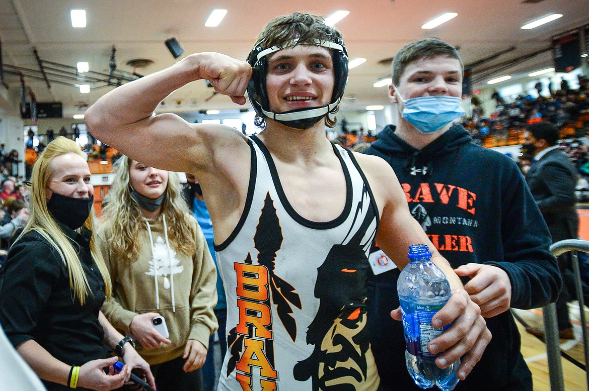Flathead's Ethan Freund celebrates after his first place victory over Billings West's Jesse Aarness at 126 lbs. at the State AA wrestling tournament at Flathead High School on Saturday. (Casey Kreider/Daily Inter Lake)
