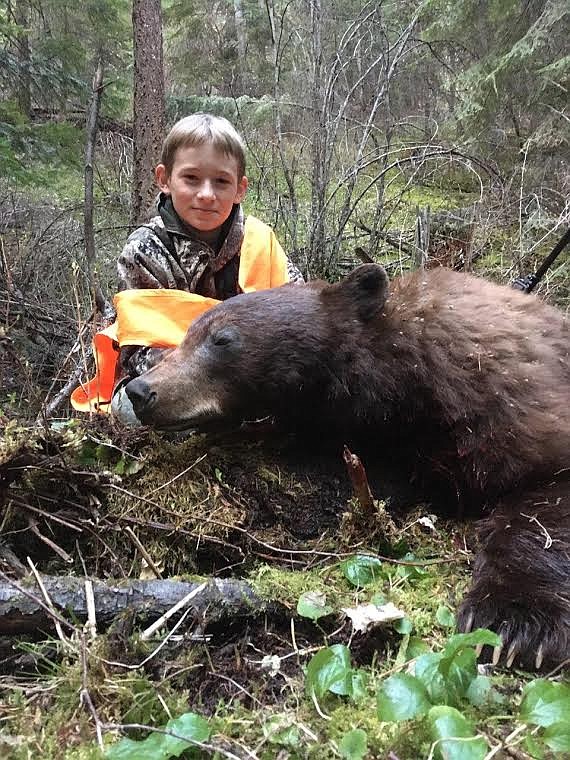 First-year hunter Garrett O’Day, of Superior, shows off a nice black bear he bagged last year. O’Day didn’t fill his coveted bison tag, but his season was still a huge success as he bagged a white-tailed buck and a wild turkey. (Courtesy photo)