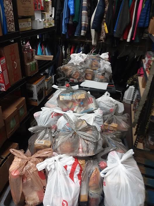 Dozens of bags of food were ready to go to support the Superior Schools Food Pantry. (Monte Turner/Mineral Independent)