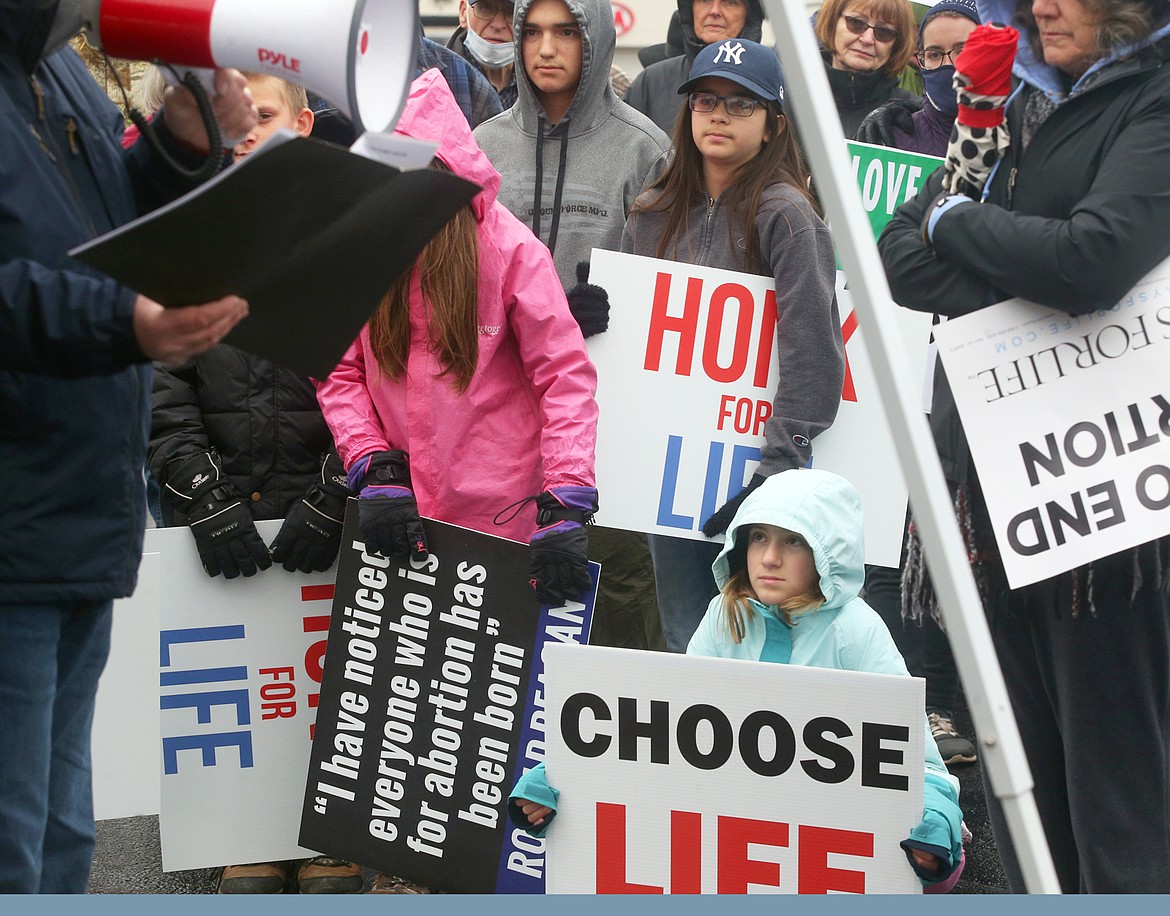 Young people were among those listening to Dr. Richard Hawk speak during Saturday's Right to Life rally in Coeur d'Alene.