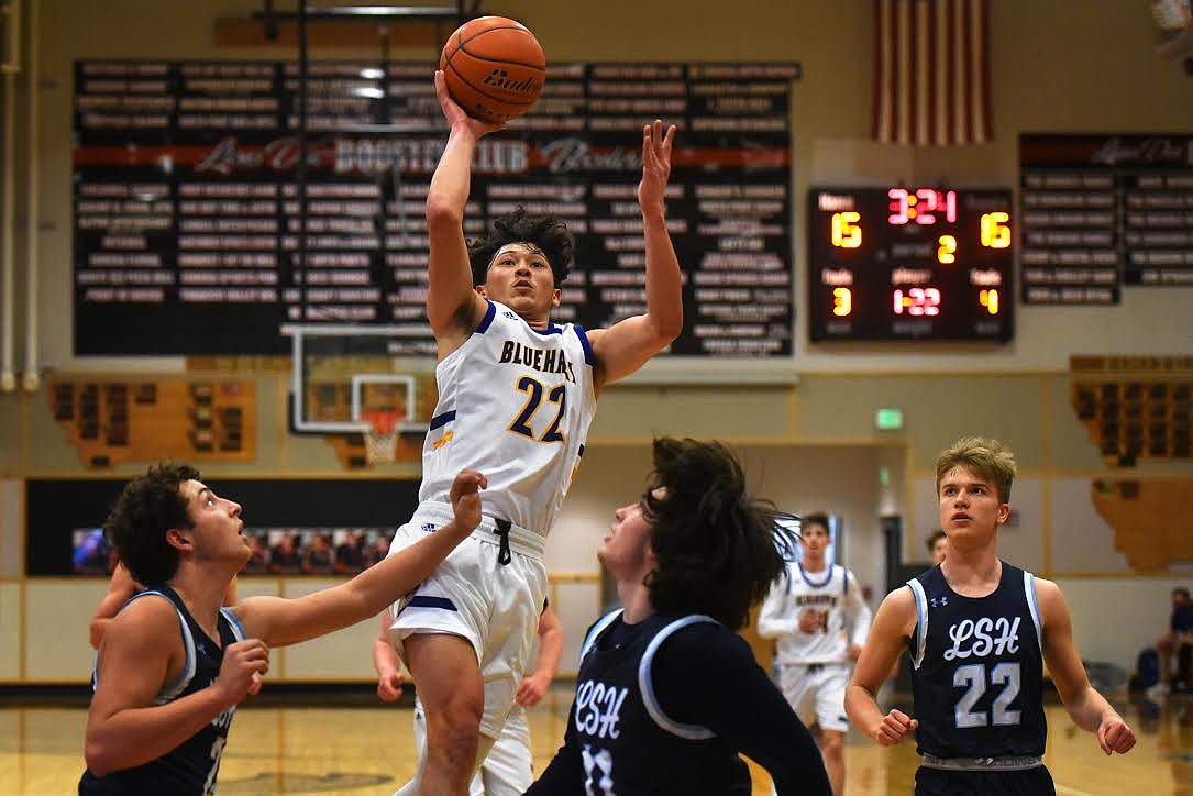 Thompson Falls' Dante Micheli goes to the basket against Loyola in the Class 7-B District tournament in Eureka. (Jeremy Weber/Valley Press)