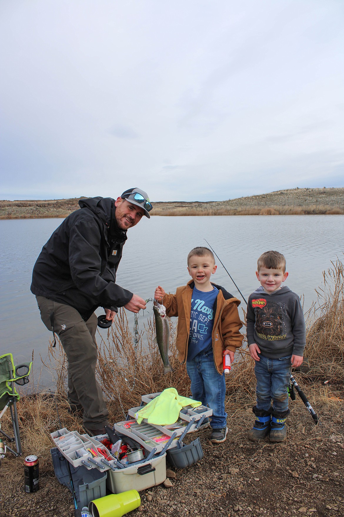 Left to right, DJ Caudill, Graham Caudill and Beckham Motzkus show off their catch at the Quincy Youth Fishing Day Saturday.