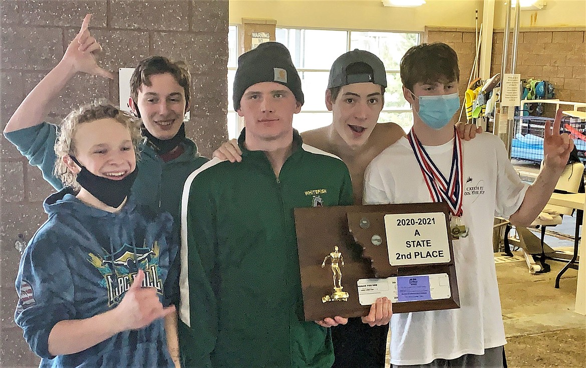 The Whitefish Boys Swim team recieves the State A second place plaque on Saturday, March 6 in Polson. (Scot Heisel/Lake County Leader)