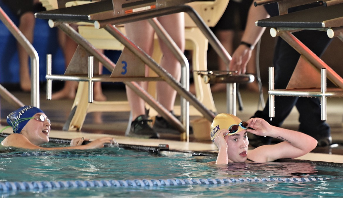 Polson's Aspen McKee removes her goggles after her 200-yard freestyle heat. (Scot Heisel/Lake County Leader)