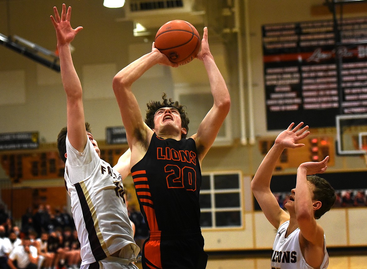 Eureka's Gavin Bates goes up for a tough two points in the opening round of the Class B Western Divisional Basketball Tournament Thursday. (Jeremy Weber/Daily Inter Lake)