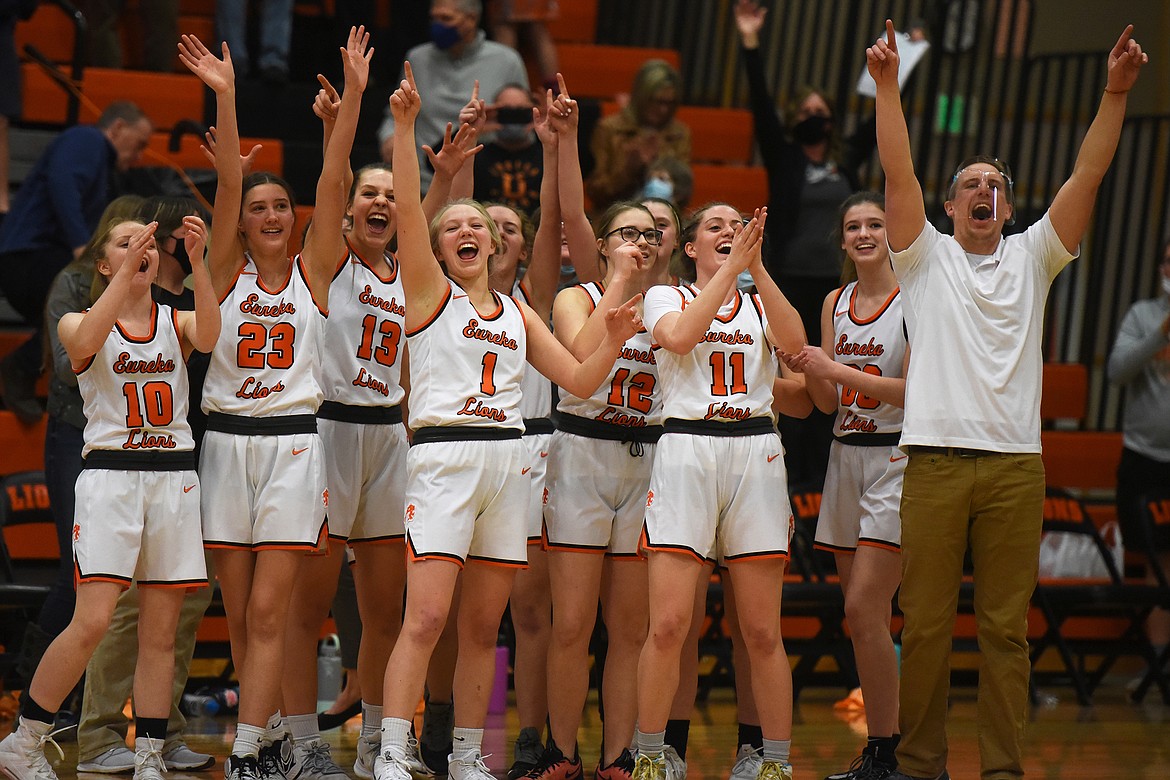The Lady Lions celebrate after Eureka defeated Anaconda 64-50 to earn the Western B Divisional Basketball title Friday. (Jeremy Weber/Daily Inter Lake)