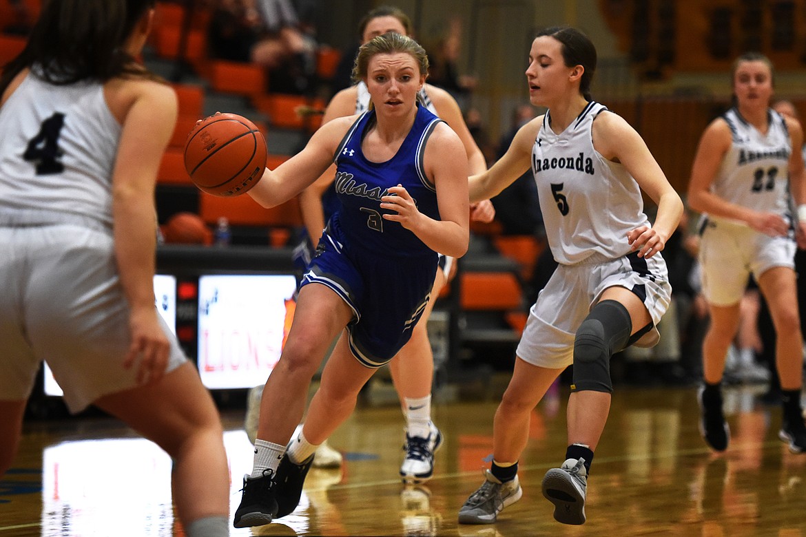 Mission's Gabby Smith brings the ball up the floor against Anaconda.