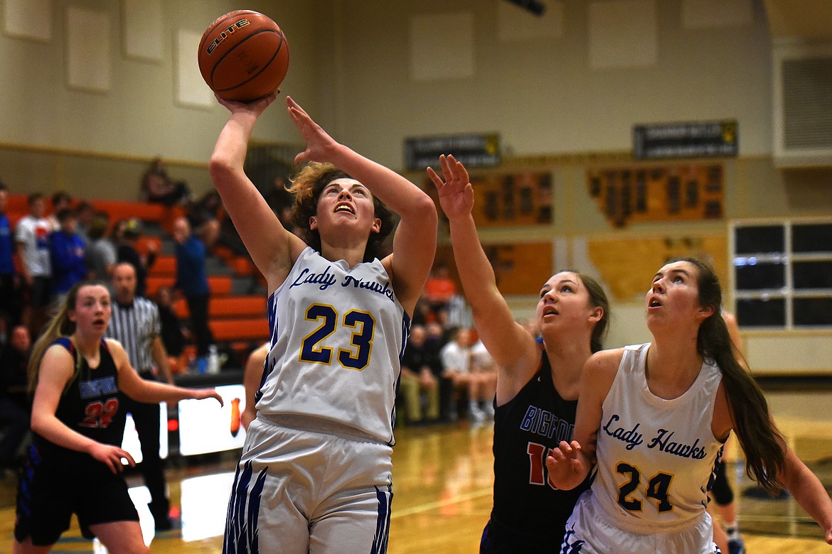 Jody Detlaff takes the ball to the hoop for Thompson Falls against Bigfork.