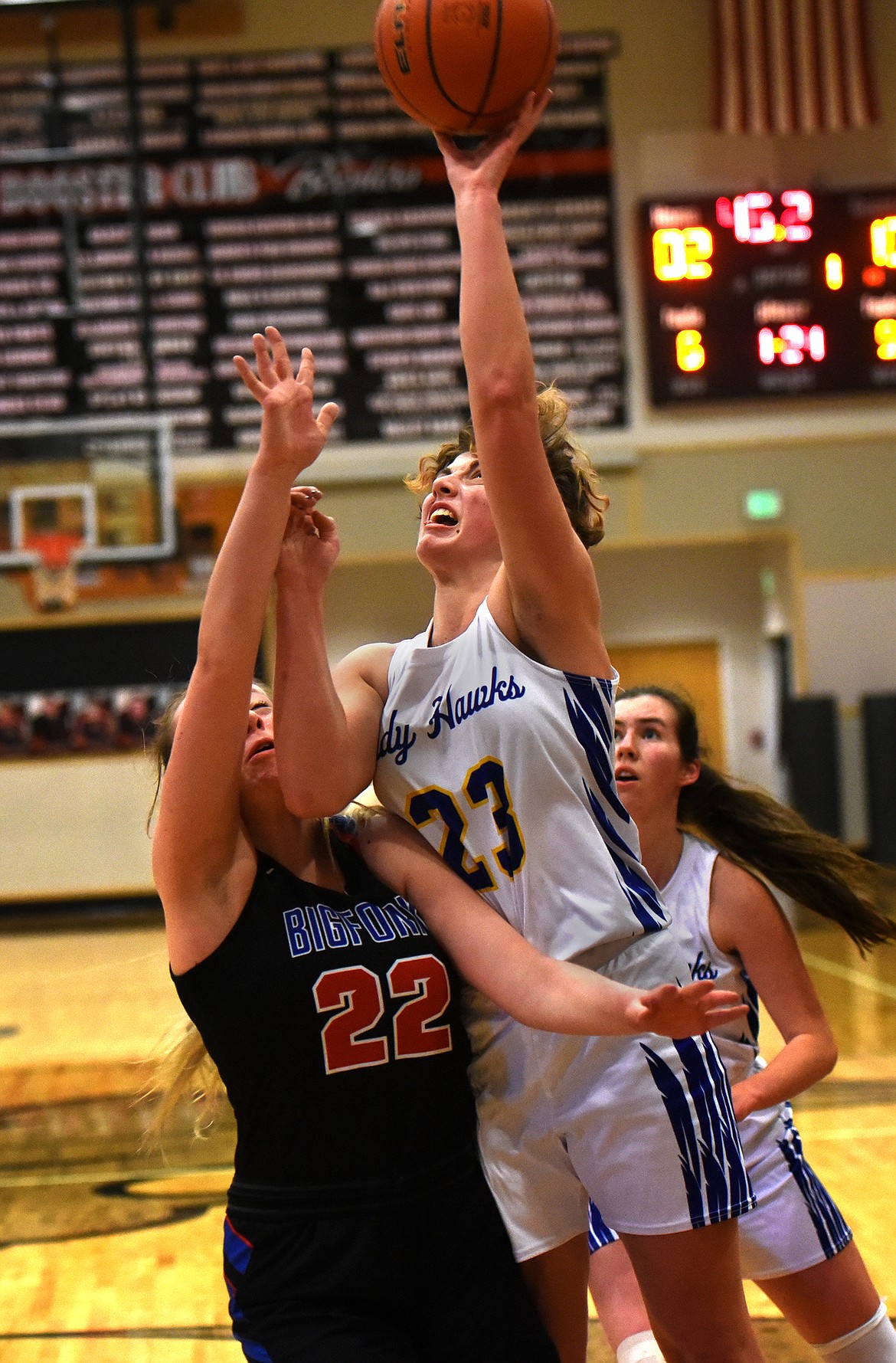 Jody Detlaff takes the ball up for Thompson Falls against Bigfork defender Scout Nadeau.