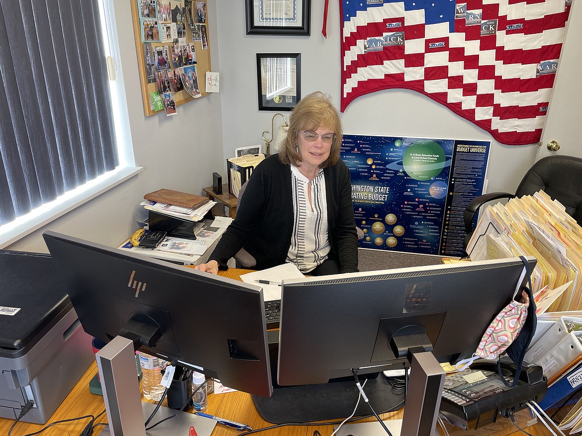 Sen. Judy Warnick, R-Moses Lake, sits in front of her "control center" on Tuesday during this year's online session of the Washington State Legislature. But Warnick and Rep. Tom Dent, R-Moses Lake, who represent the 13th District (along with Alex Ybarra, R-Quincy), miss not being in Olympia for an in-person legislative session.