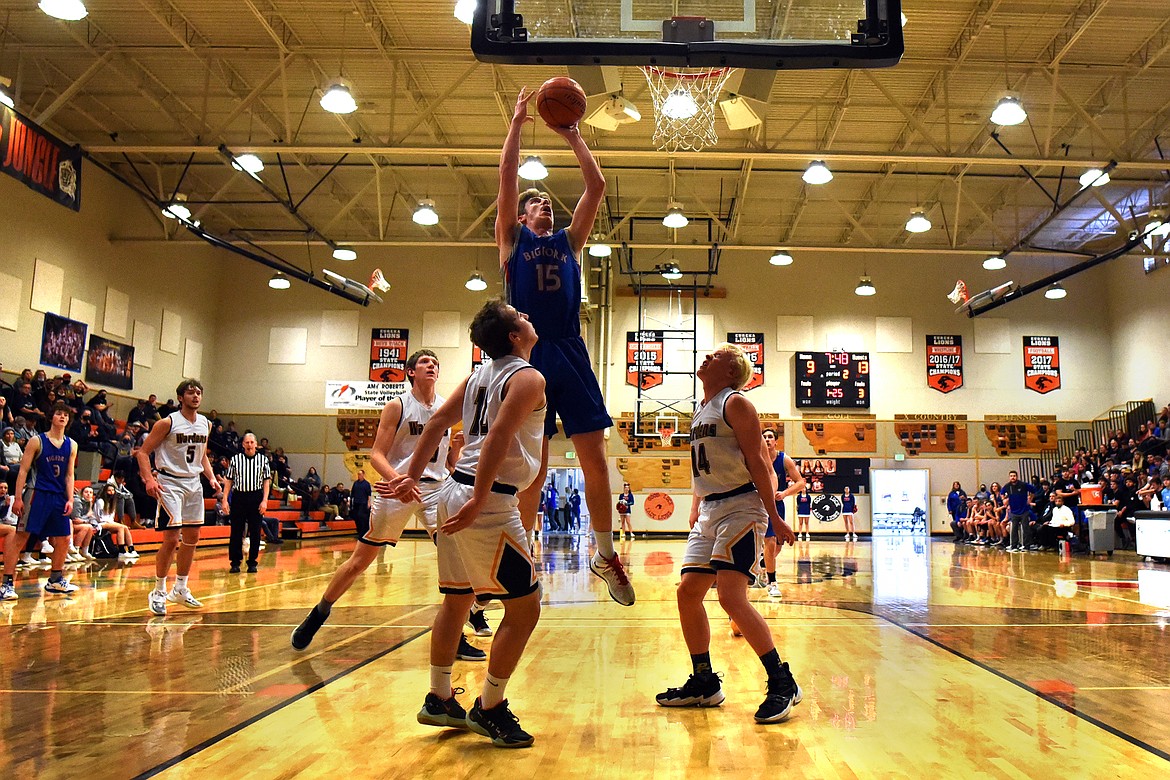 Bigfork's Bryce Gilliard rises above the Deer Lodge defense for two points in the semifinals of the Western B Divisional Basketball Tournament in Eureka Friday.
Jeremy Weber/Bigfork Eagle