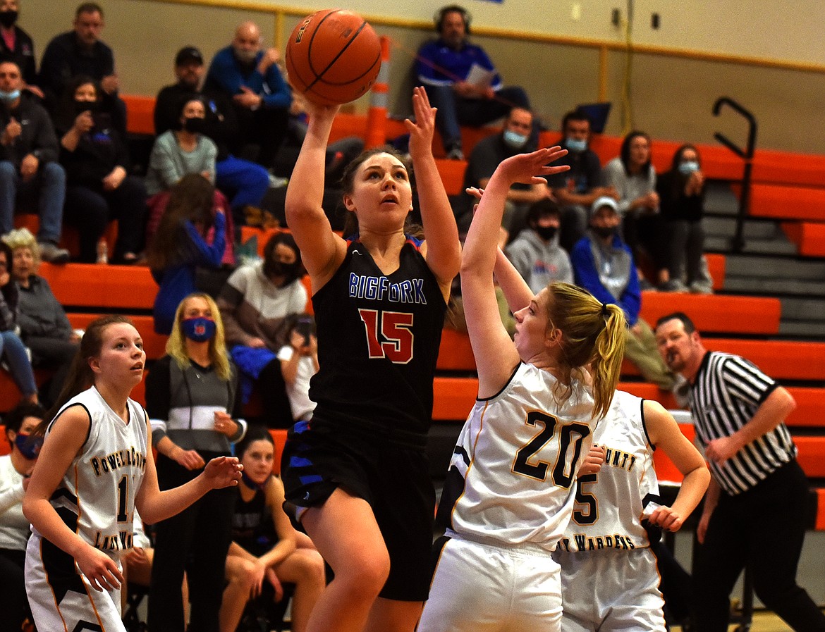 Bigfork's Madison Chappuis goes up for a shot over Deer Lodge defender Emma Johnson in the fourth quarter of the Valkyries 51-14 win at the Western B Divisional Basketball Tournament Thursday.
Jeremy Weber/Bigfork Eagle