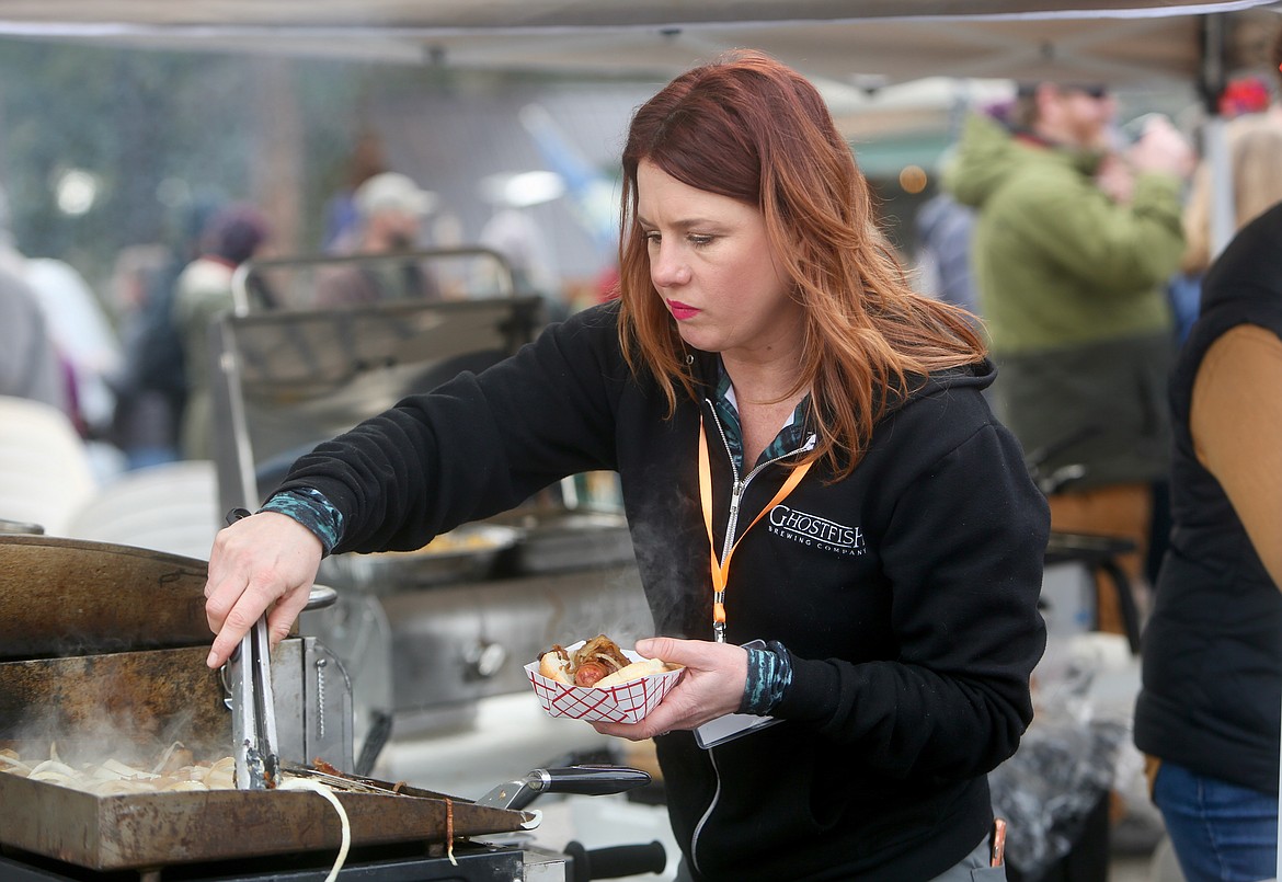 A vendor serves up a bratwurst hot off the grill at Sunday's Bigfork Brewfest.
Mackenzie Reiss/Bigfork Eagle