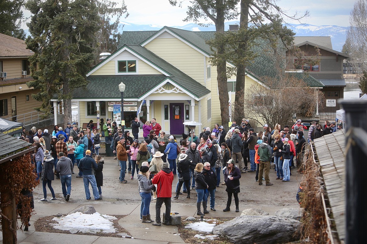 Hundreds of people socialize over beers at Bigfork Brewfest last Sunday along Electric Avenue.
Mackenzie Reiss/Bigfork Eagle