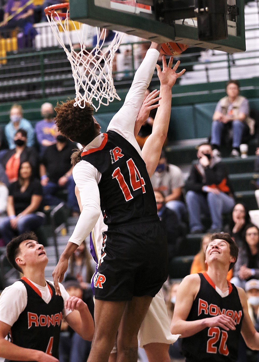 Ronan's Girma Detwiler goes up for a block Saturday against Polson (Courtesy of Bob Gunderson)