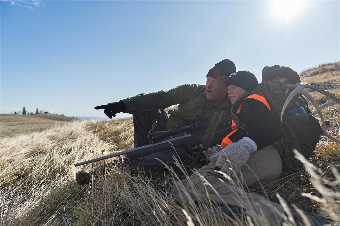 A young hunter and his father explore ranch land in the Bears Paw Mountains looking for mule deer during Montana’s early youth big game hunt. (Courtesy of Tony Bynum)