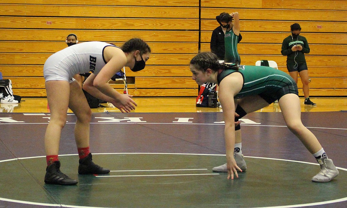 Big Bend wrestling team captain Kayla Rogers, left, squares up with her opponent on the mat on Saturday afternoon at Big Bend Community College.