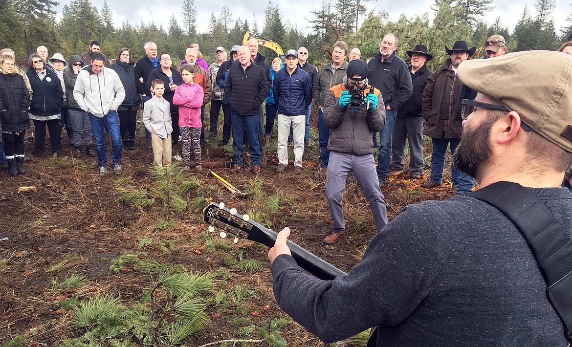 Jeremy Ellis leads the music during last Sunday's groundbreaking for Real Life Ministries new north campus off Highway 54 near Athol.