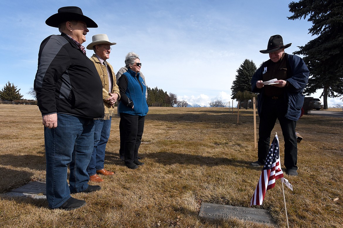 Former FBI Special Agents Warren Little (right) is joined by fellow former agents Gary Wanberg, Mickey Clark, Sue Borrego and widow of a deceased agent Marian Strong (obscured) as they honor FBI service martyr Terry Hereford at Kalispell's Glacier Memorial Gardens Tuesday. (Jeremy Weber/Daily Inter Lake)