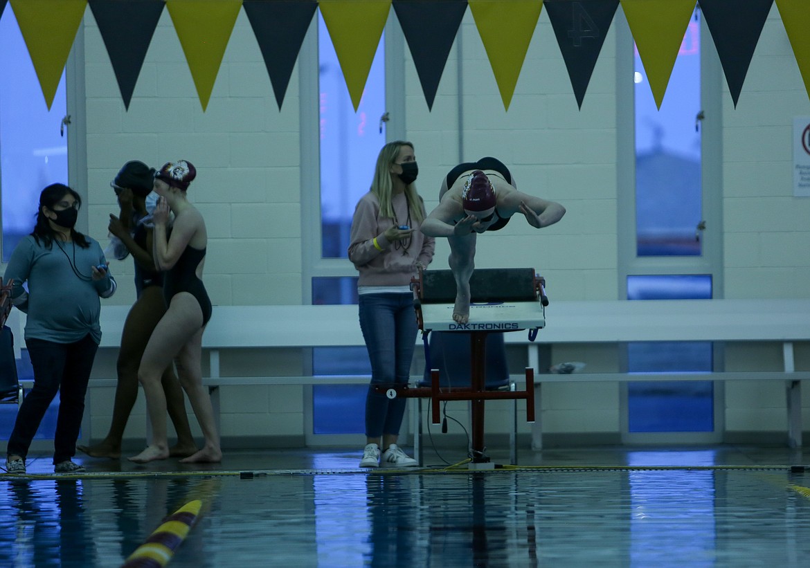 Moses Lake's Laurel Knox leaves the starting box as the final heat of the 50 yard freestyle individual event kicks off at Moses Lake High School on Thursday night.