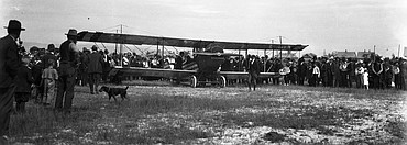 Curious Kalispell residents gather around a visiting barnstormer and his plane in 1920. (Vernon Weed photo)
