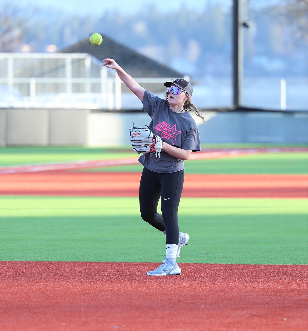 Jacey Cash throws a ball toward home plate during a practice last week at War Memorial Field.