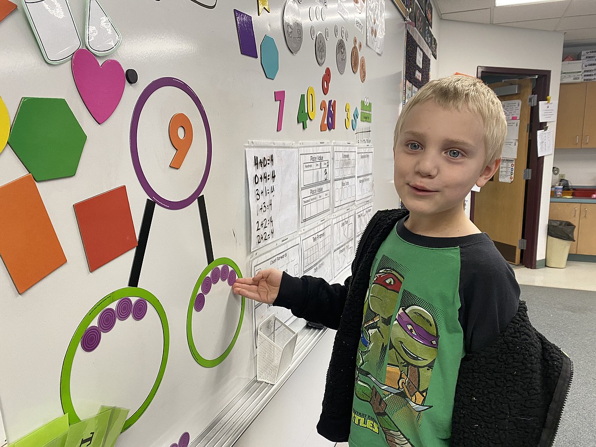 Betty Kiefer Elementary School kindergartener Gunnar Pursley works on his number bonds by playing with what he calls "aliens" on planet Earth and Mars. (Madison Hardy/Press)