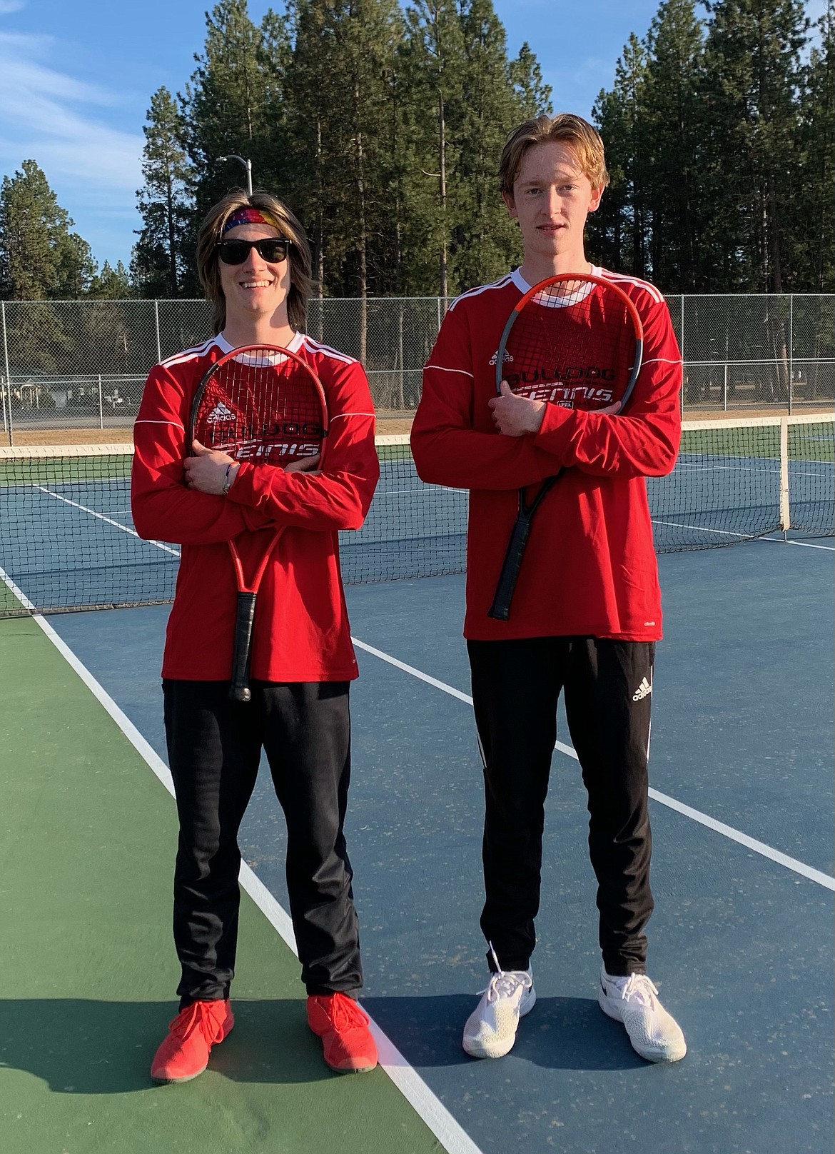 The boys No. 1 doubles pairing of Tyler McNamee (left) and Charlie Johnson went undefeated in their matches on Saturday.