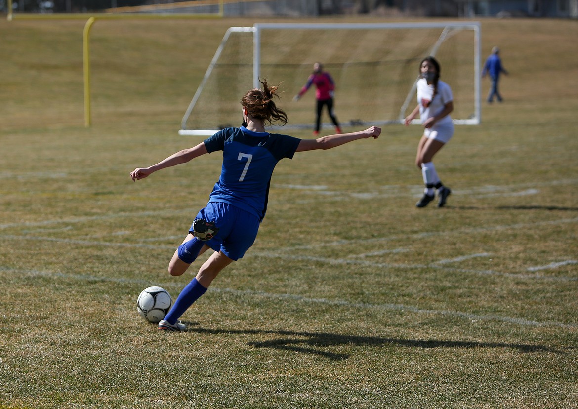 Warden's Grace Richins fires the ball in toward the goal in the first half of the Cougars' matchup with Ephrata at home on Saturday.