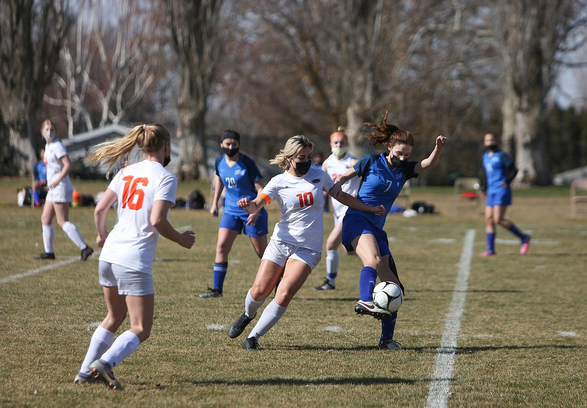 Ephrata's Lynette Sanchez (10) and Warden's Grace Richins (7) fight for the ball in the first half on Saturday afternoon at Warden High School.