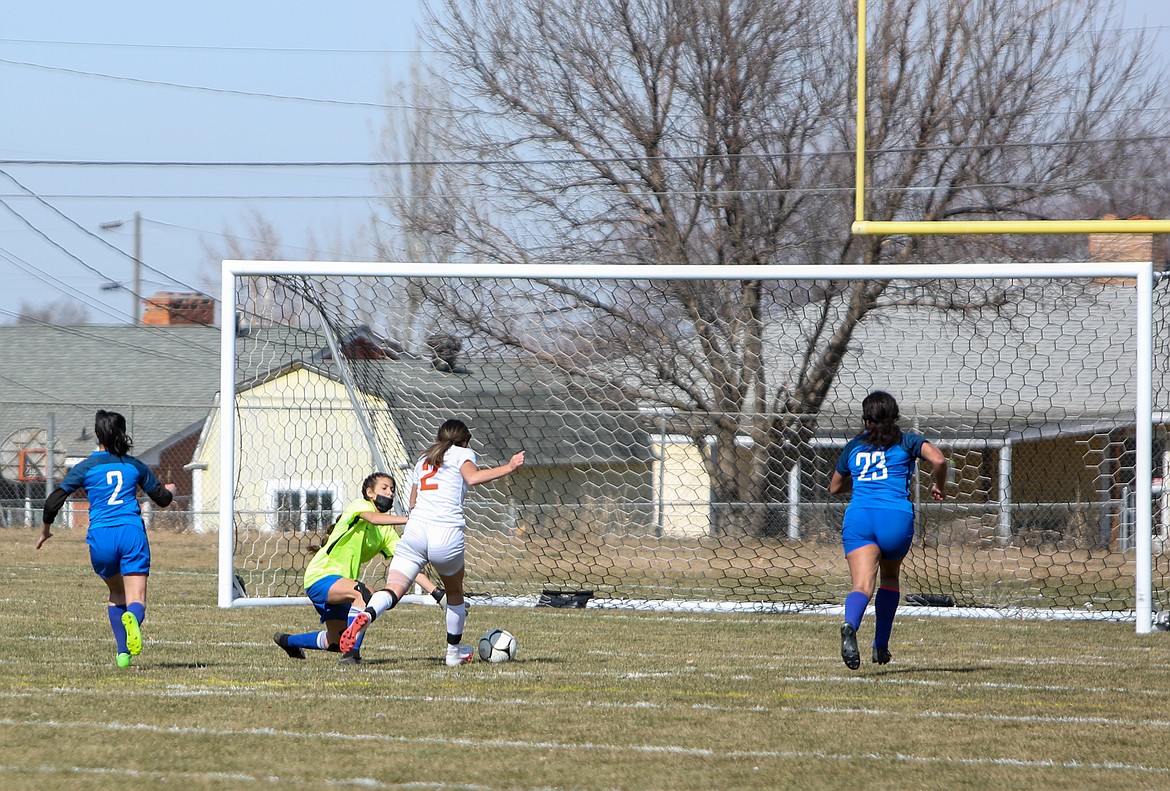 Ephrata freshman Aliya Avila dribbles past the Warden goalkeeper before taking the shot in the first half on Saturday afternoon at Warden High School.