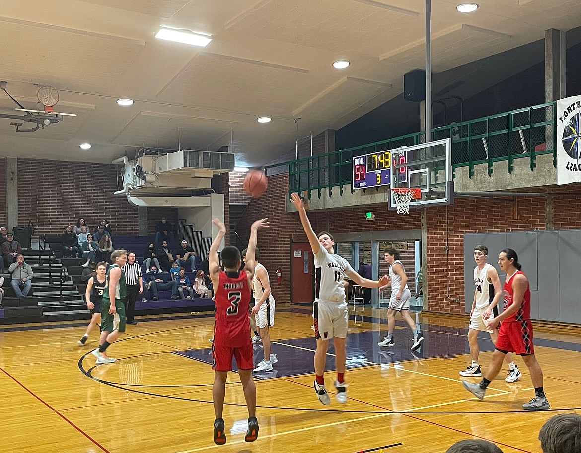 Wallace's Will Farkas attempts to block Jasper Abuan's (Lakeside) 3-point attempt during the second half of the District I All-Star Game at the Mullan Pavilion.